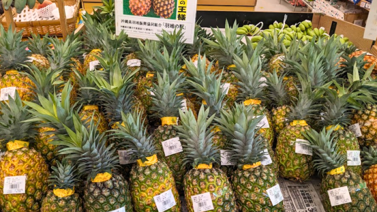Pineapples stacked on the shop floor at Haneji-no-Eki