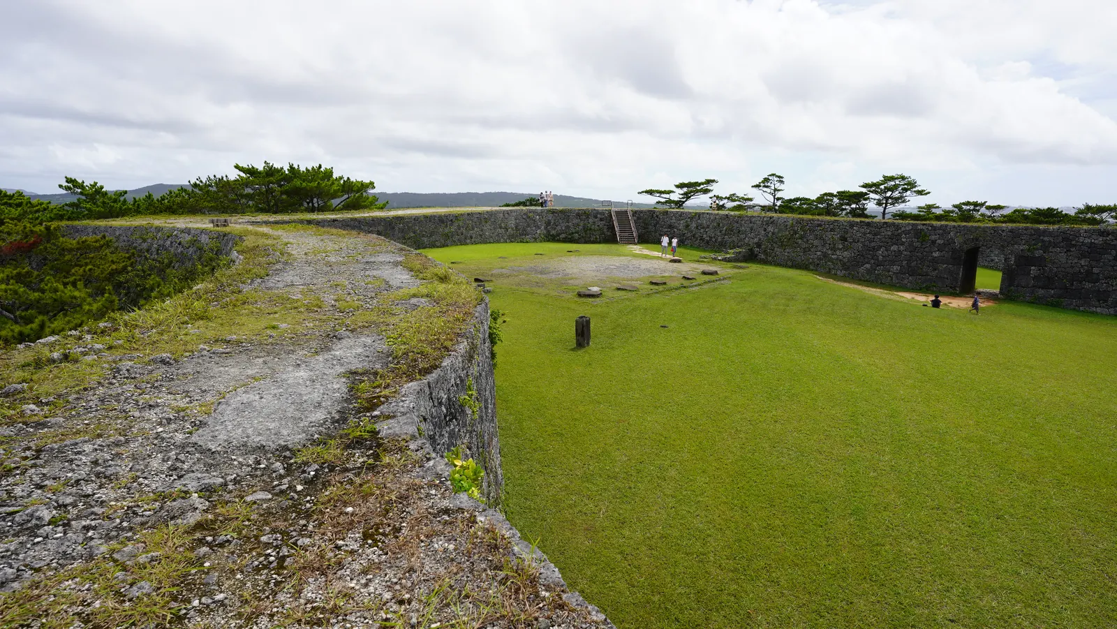 The wall tops at Zakimi Castle, wide enough to walk along, curving around the lawn